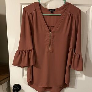 Express vneck half zip blouse with ruffle 3/4ths sleeves. Size medium.